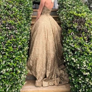 A couture Sherri hill dress- size two, bought for $10,000, asking for $7,000.